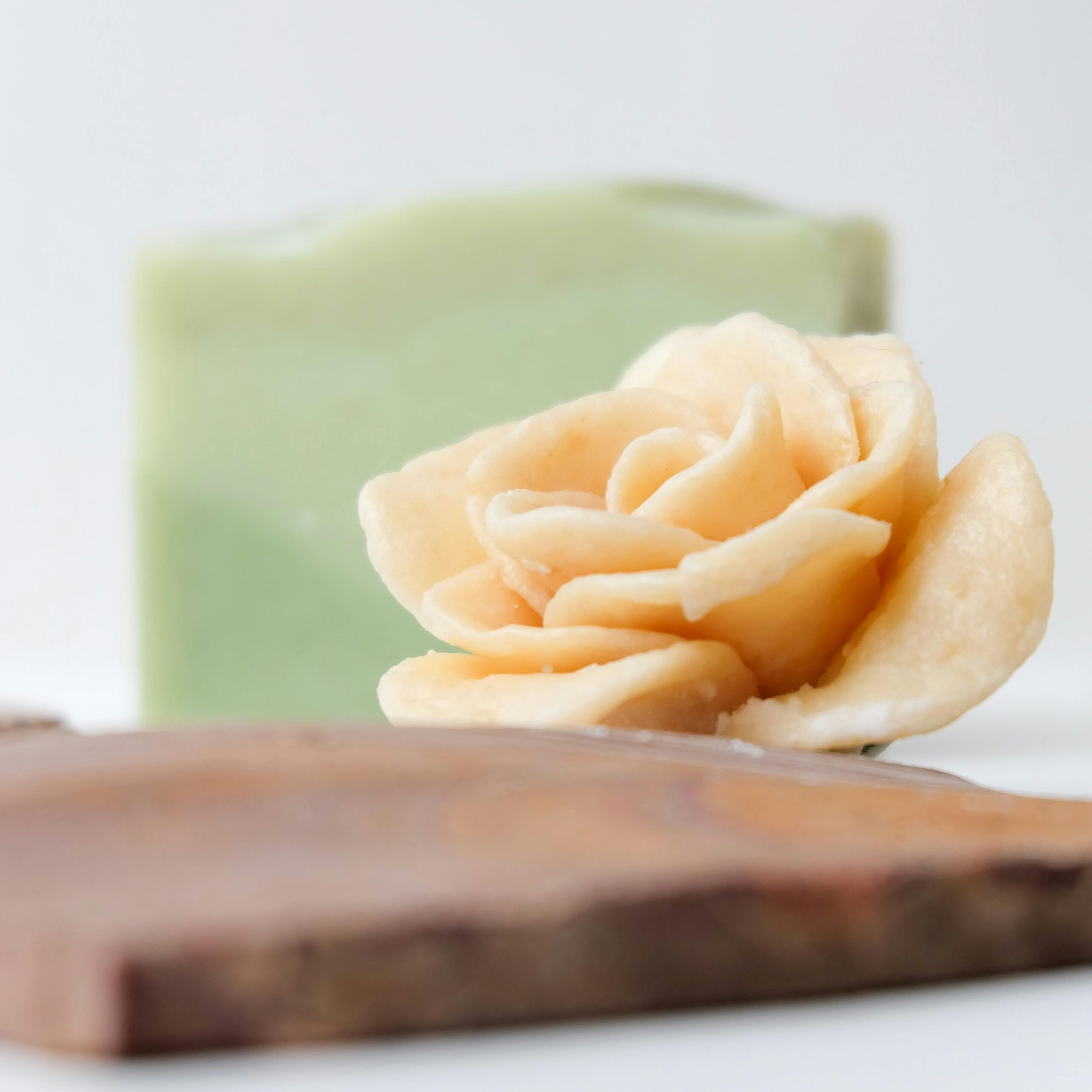 Close-up of a handcrafted soap with a beautiful flower design, perfect for a natural lifestyle.